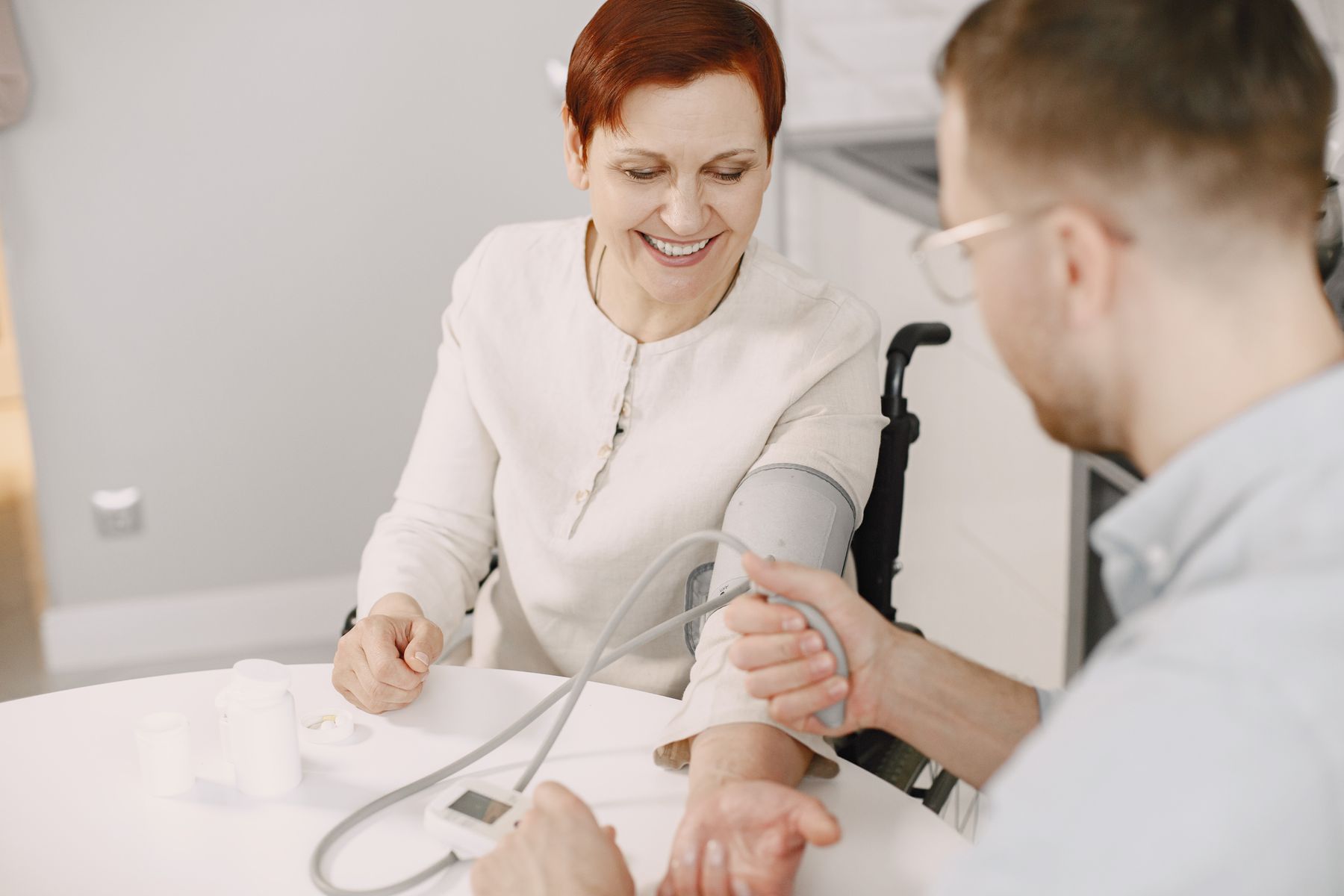 A healthcare professional providing a blood pressure check